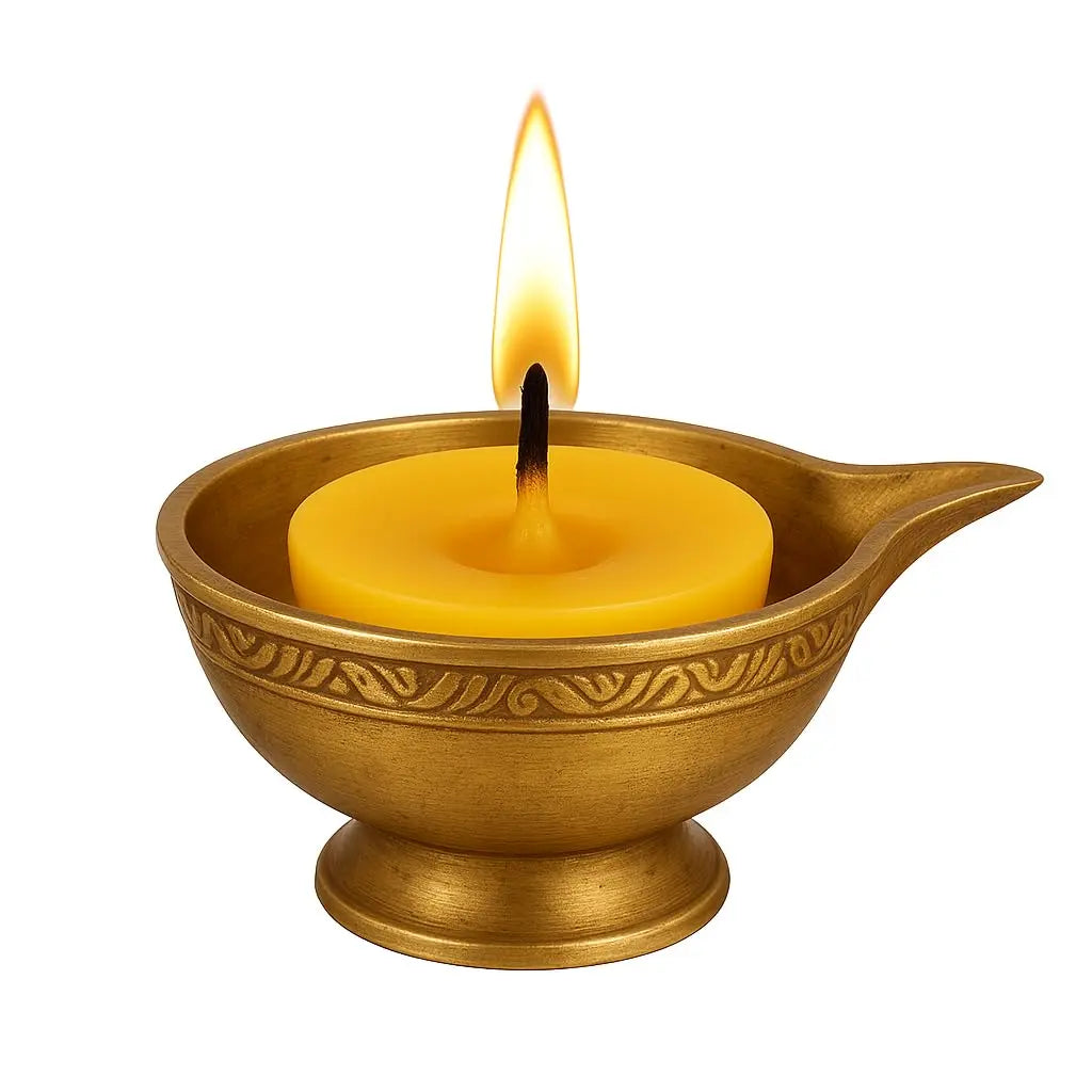 Golden diya holder with a lit yellow ghee diya batti