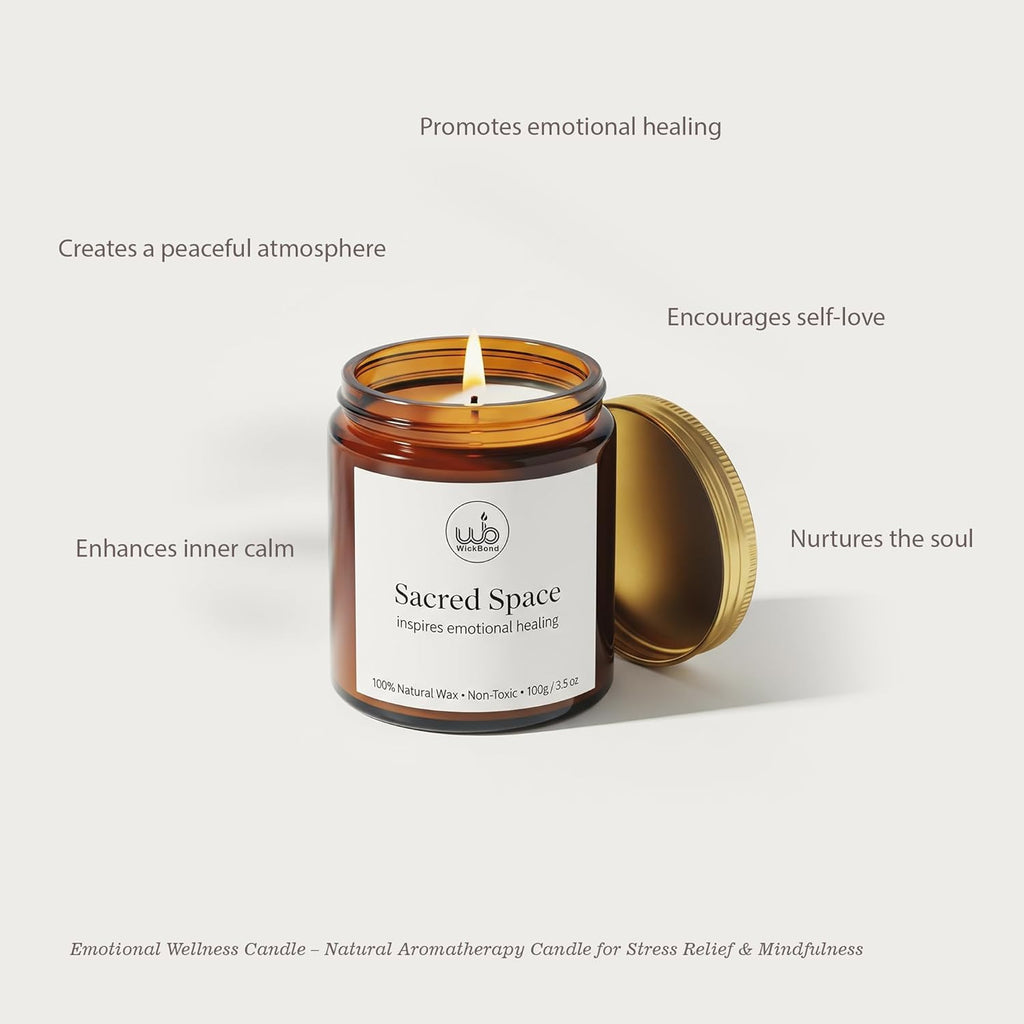 Sacred Space soy candle in amber glass jar with gold lid, lit wick
