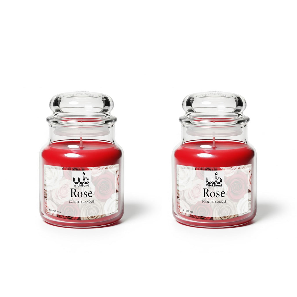 Rose scented candle in clear glass jar with metal lid and red wax
