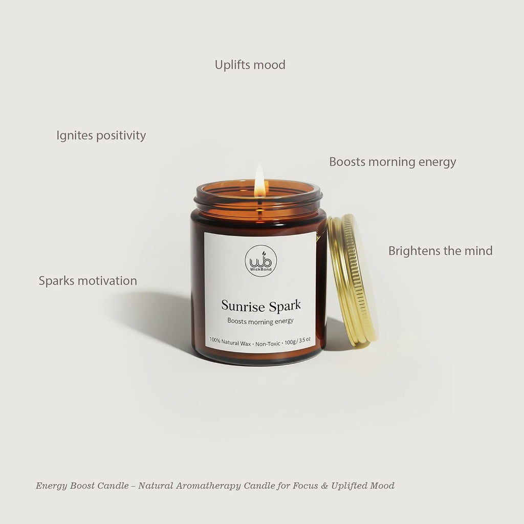 Sunrise Spark soy candle in amber glass jar with gold lid, lit wick
