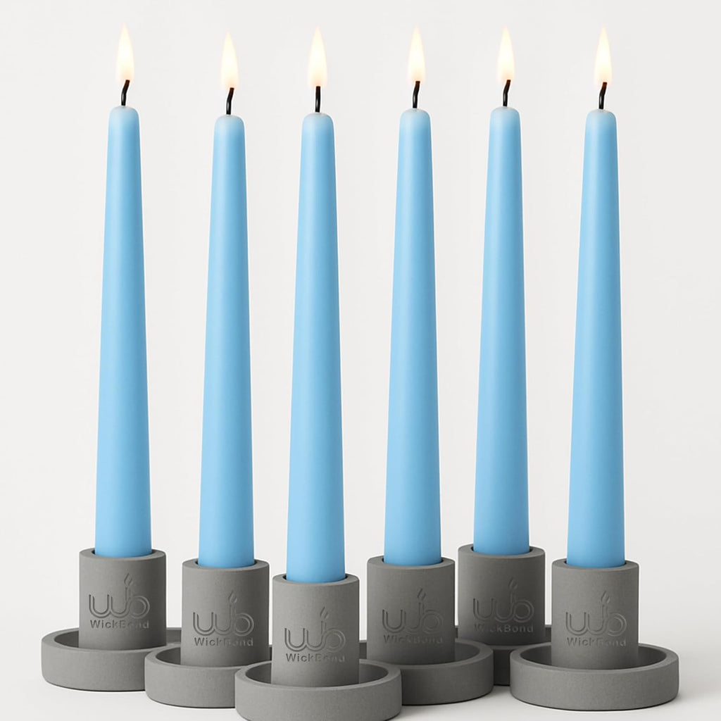 Dripless tapered candles in light blue wax with black wicks and flames, set of 7