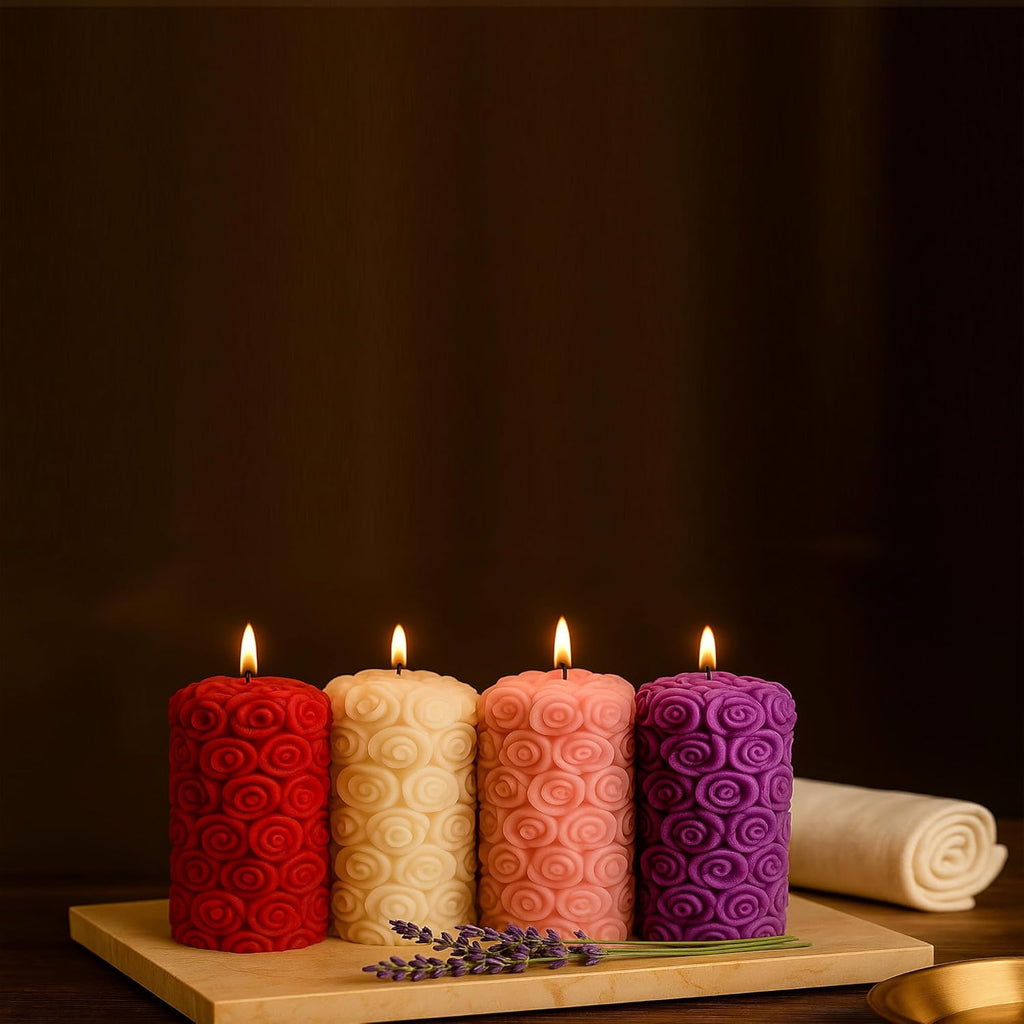 Lavender rose pillar candle pair with tall cylindrical body and rose swirl texture