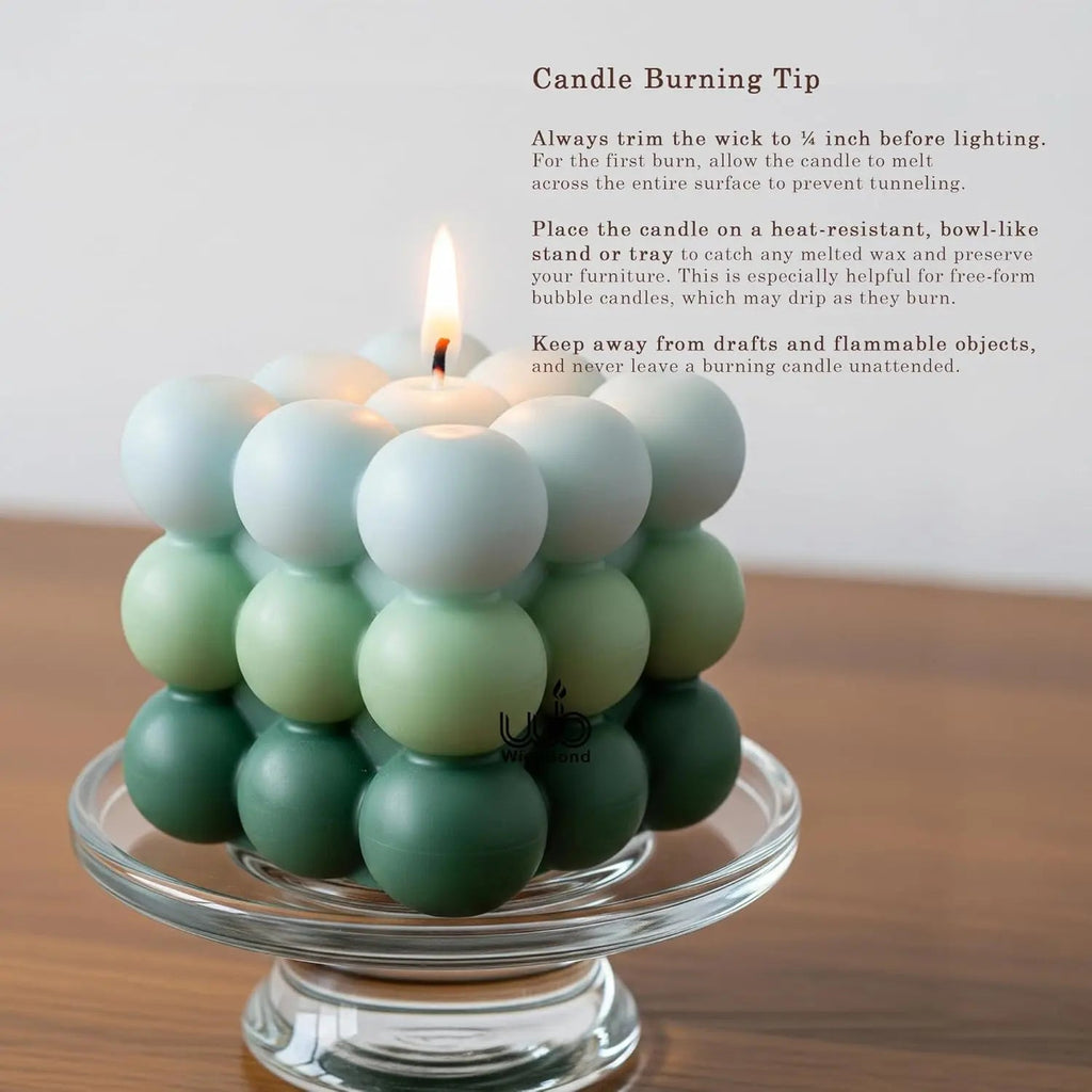 Ombre bubble cube candle in dark green and ivory, wicks visible on top bubbles