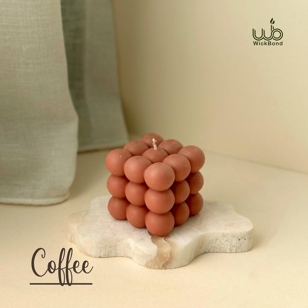 Coffee-scented bubble soy wax cube candle with orange-brown wax balls and visible wick