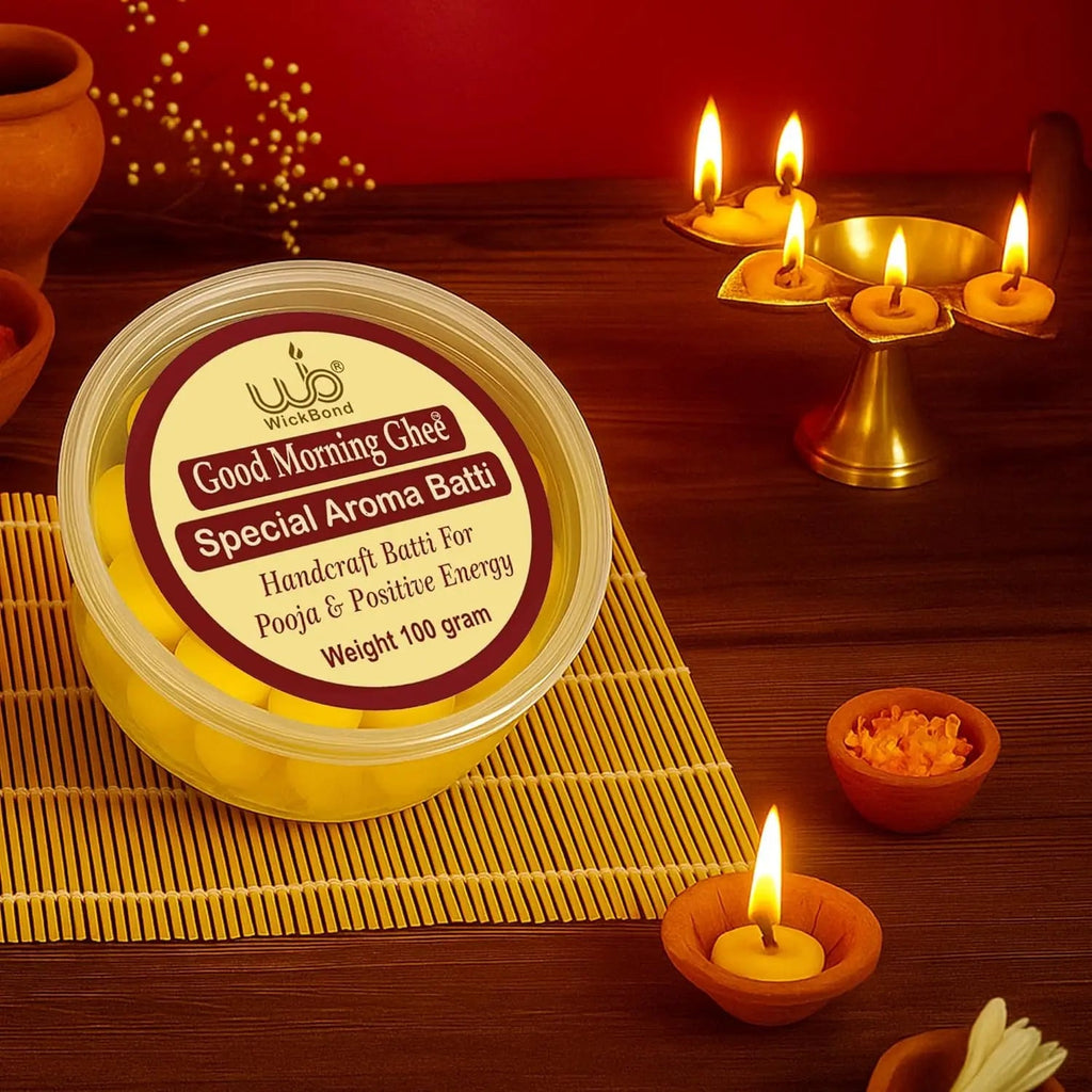 Good Morning Ghee Special Aroma Batti container with lit yellow diyas on a mat